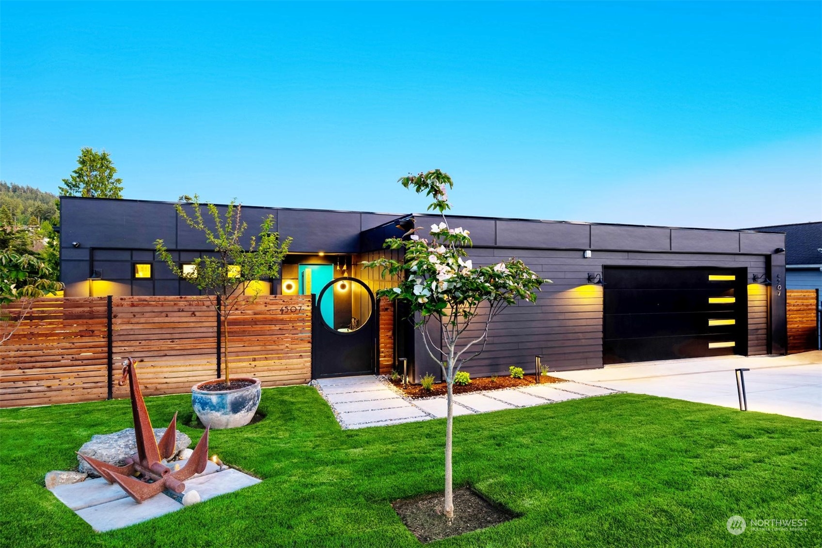 a front view of a house with garden