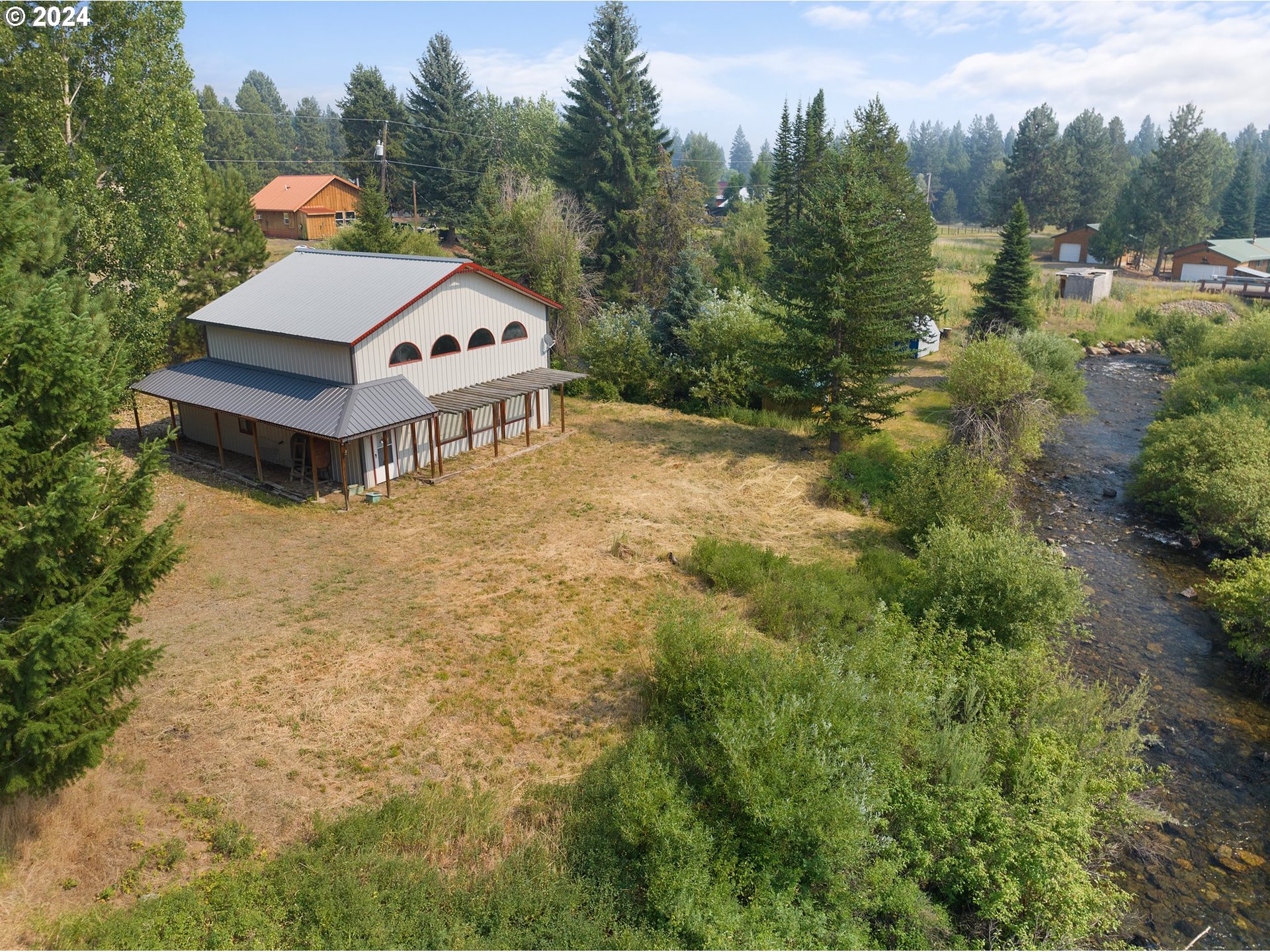 aerial view of a house with a yard