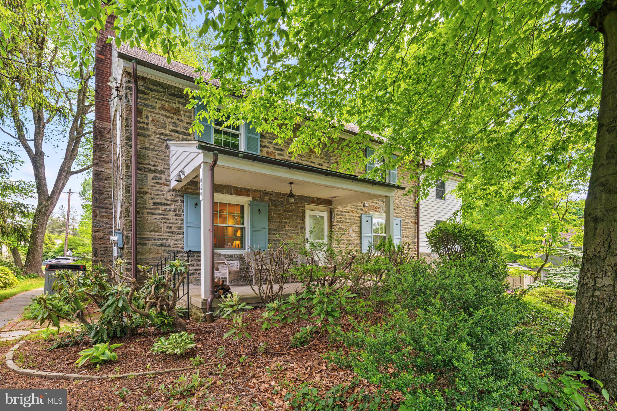 a view of a house with a tree