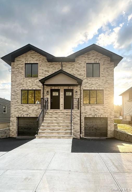 a front view of a house with a garage