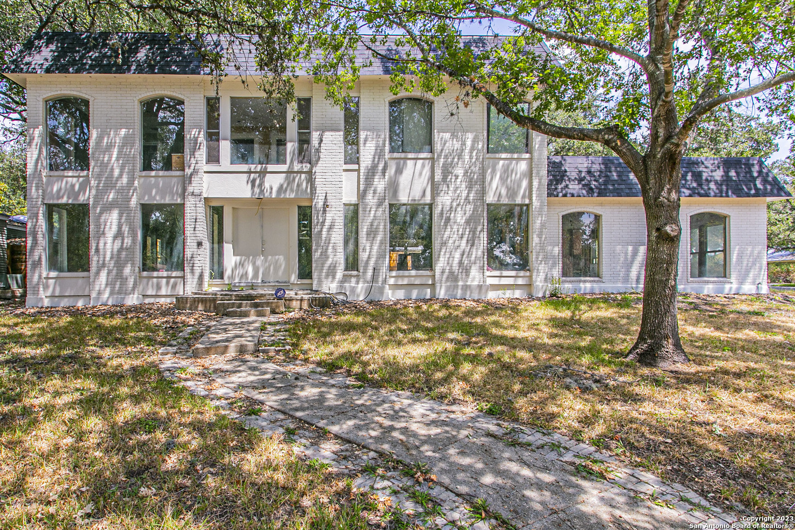 a house with trees in front of it