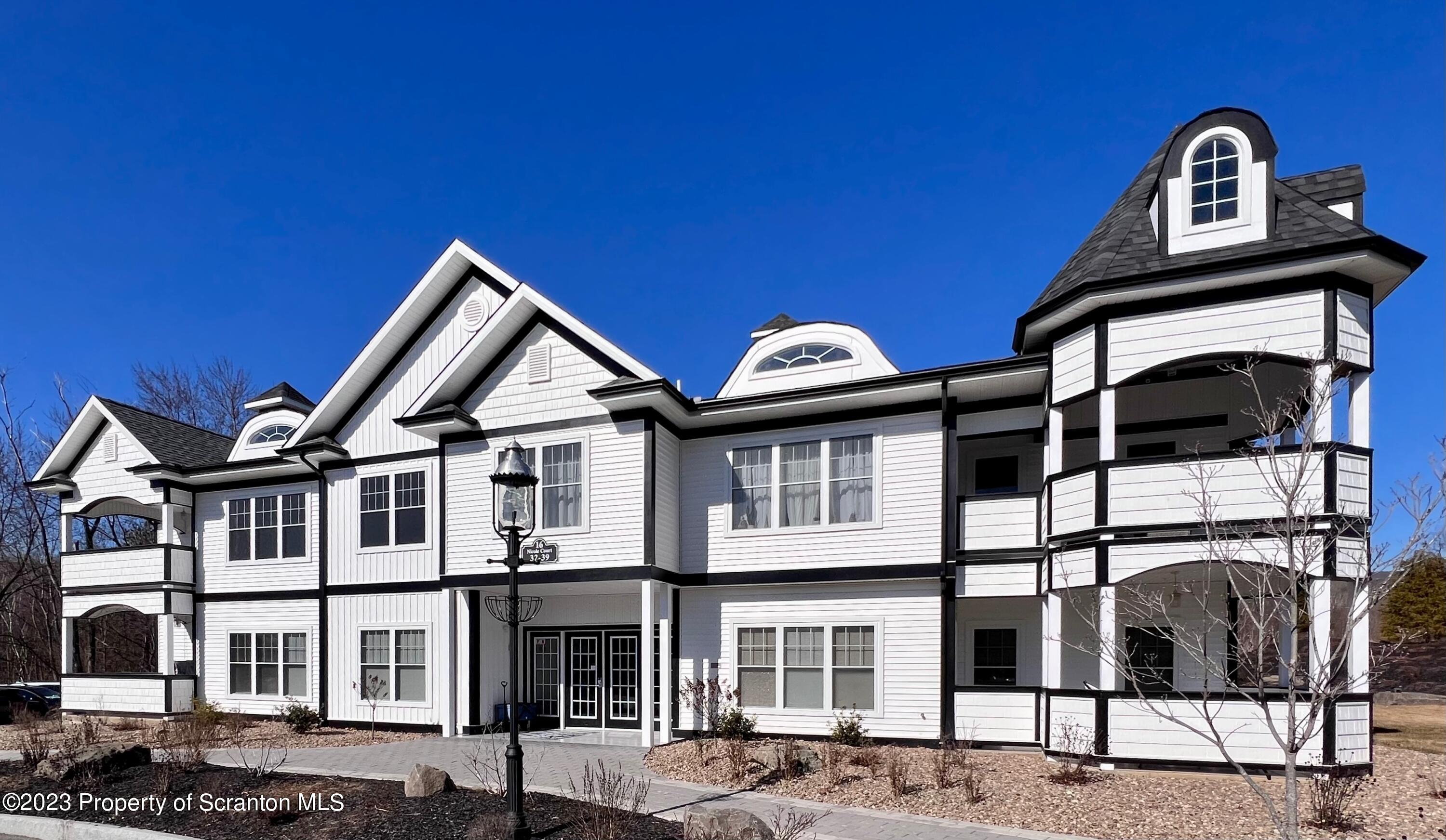 a view of a house with large windows