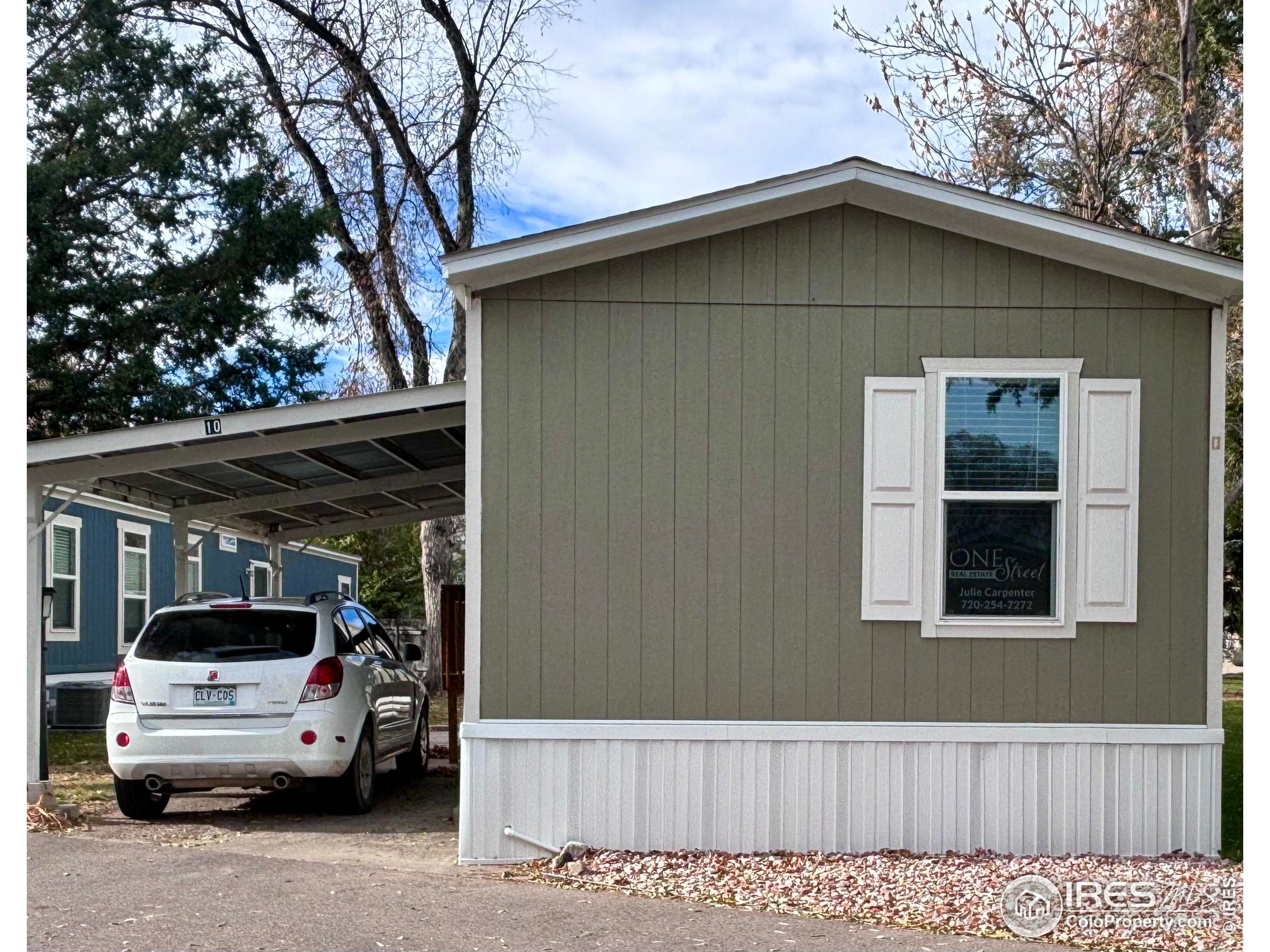 a view of garage and car parked