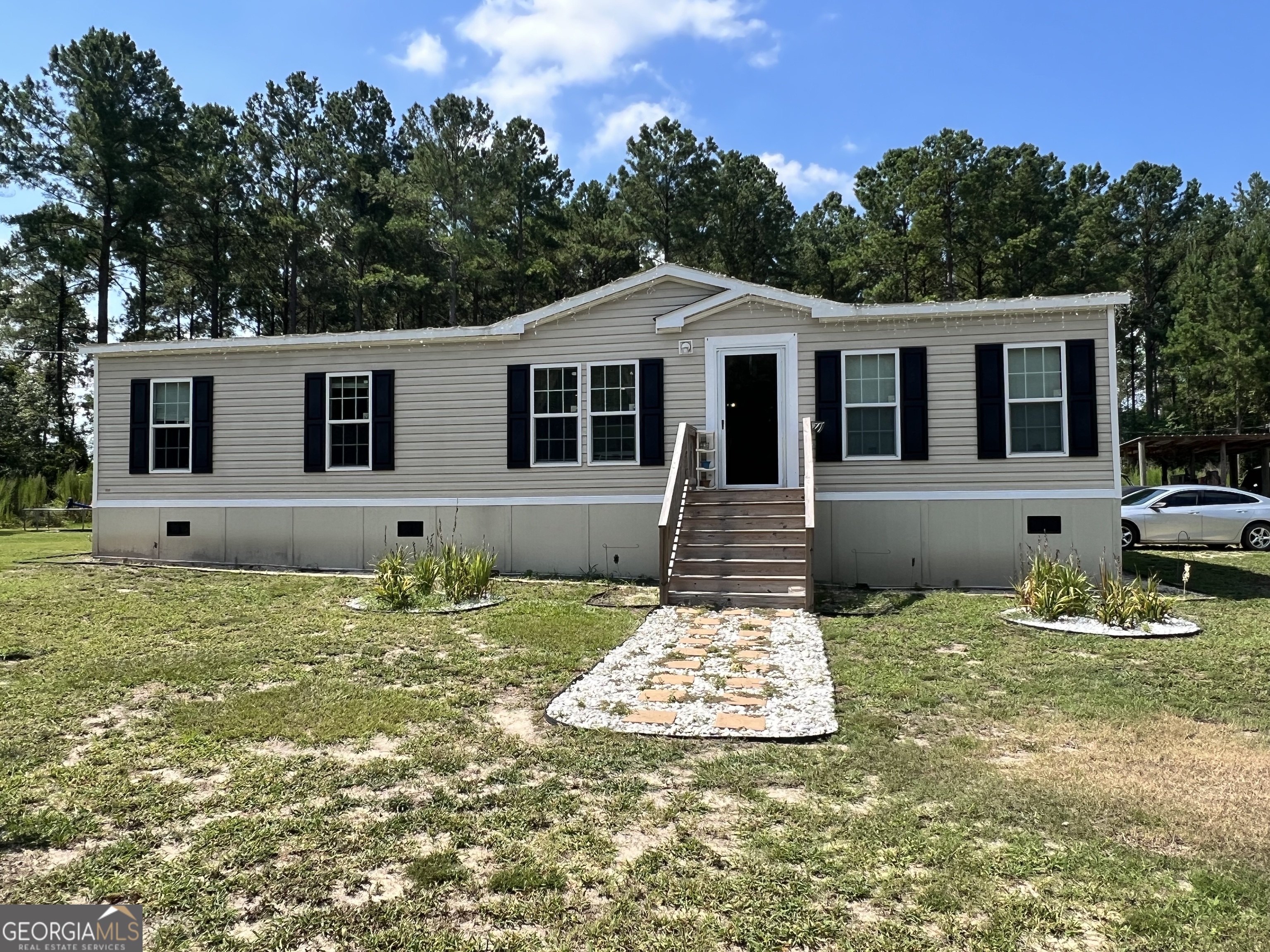 a front view of a house with a yard