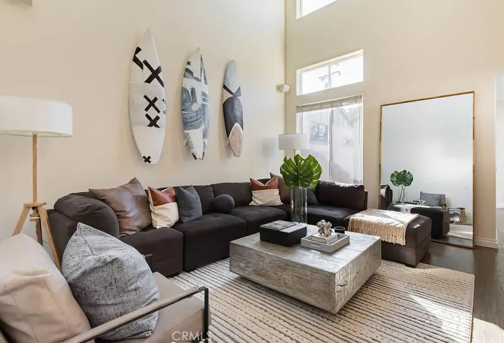 a living room with furniture and a lamp