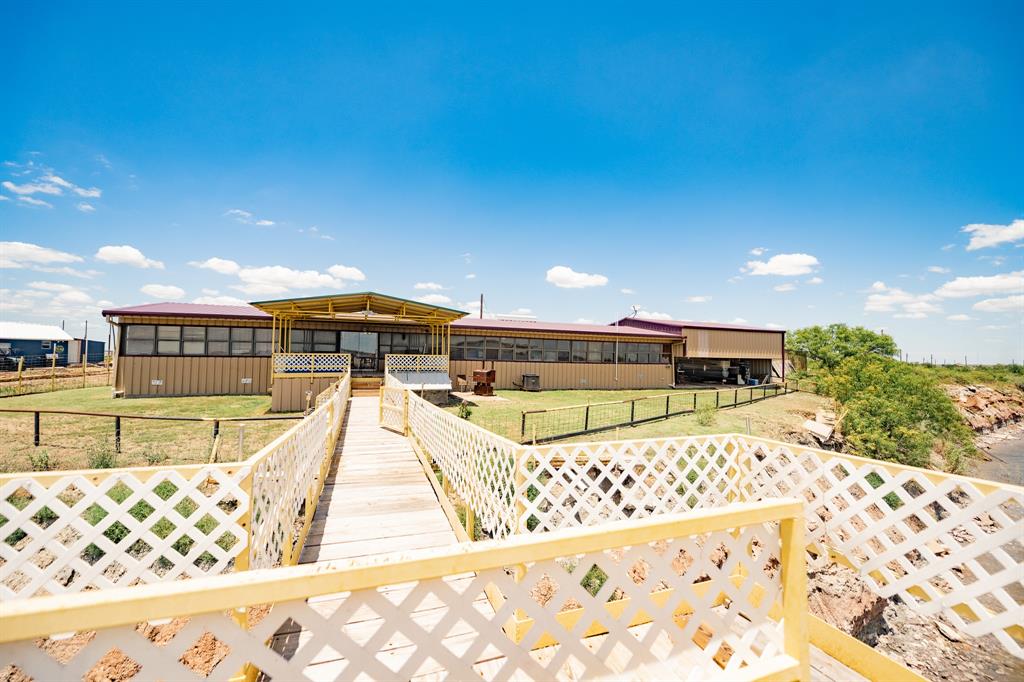 a view of a swimming pool with an outdoor seating