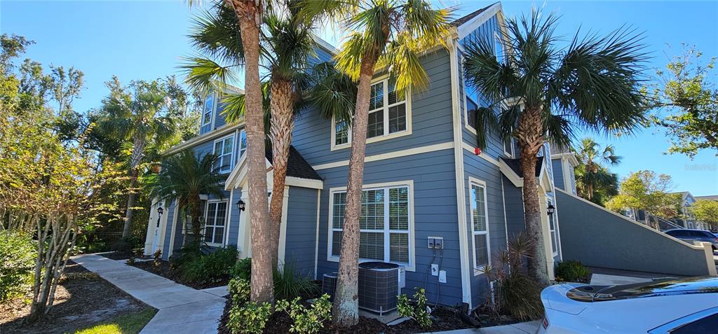 a view of a house with a tree