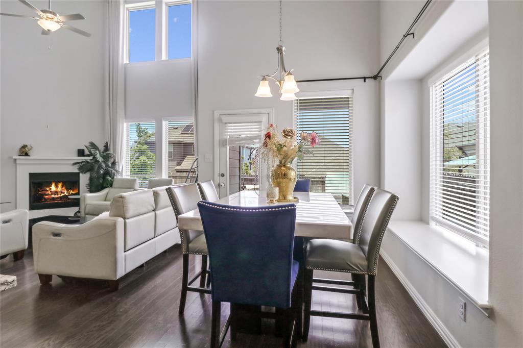 a view of a dining room with furniture wooden floor and chandelier