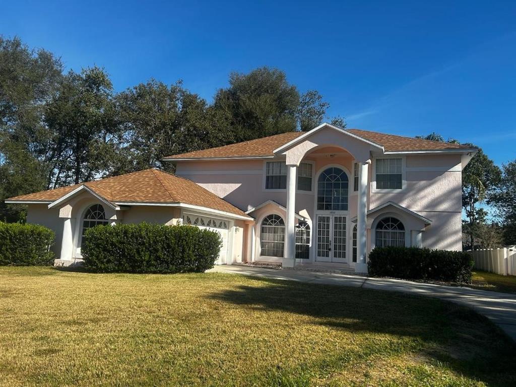 a front view of a house with a yard