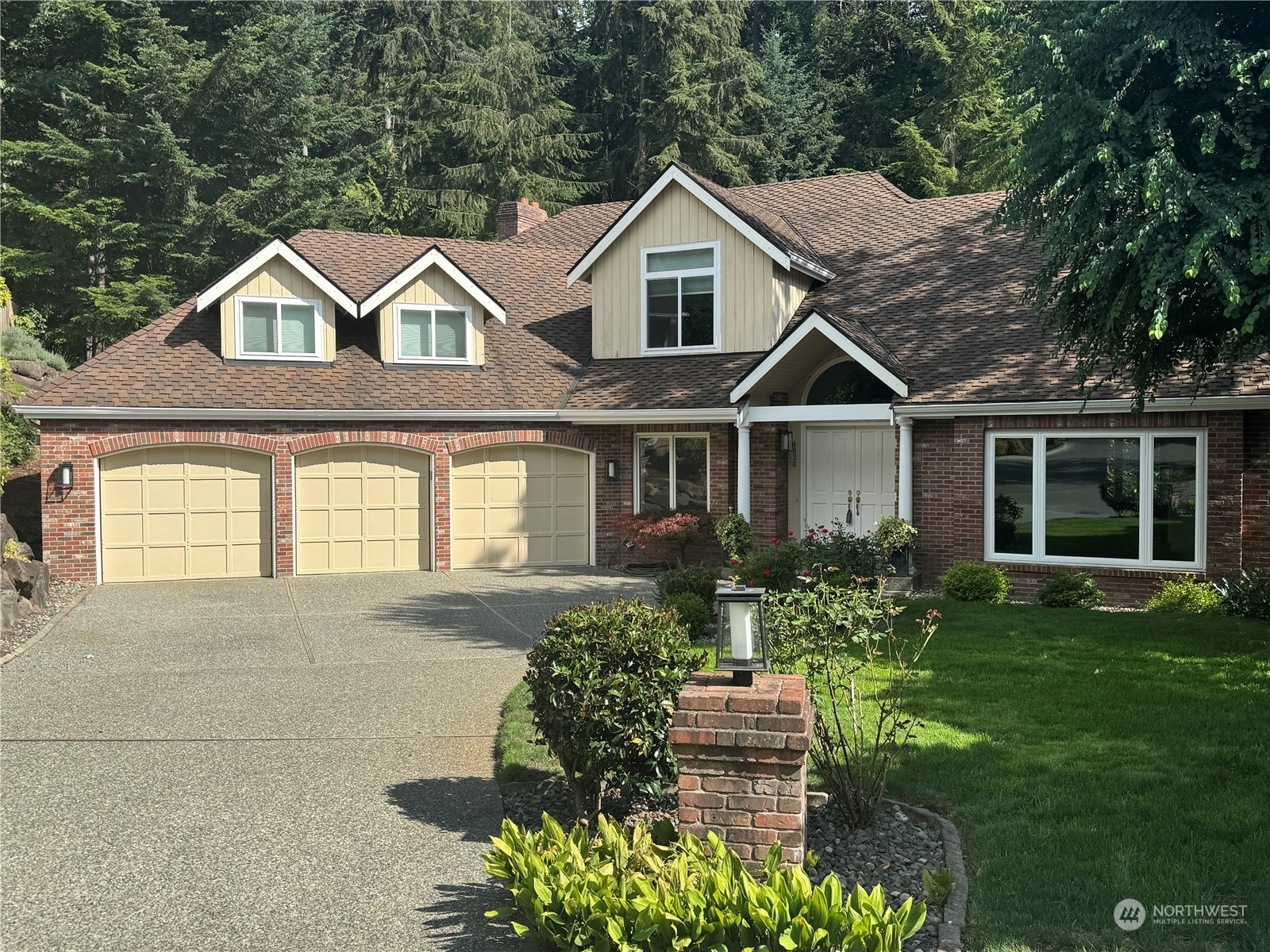 a front view of a house with a yard and porch