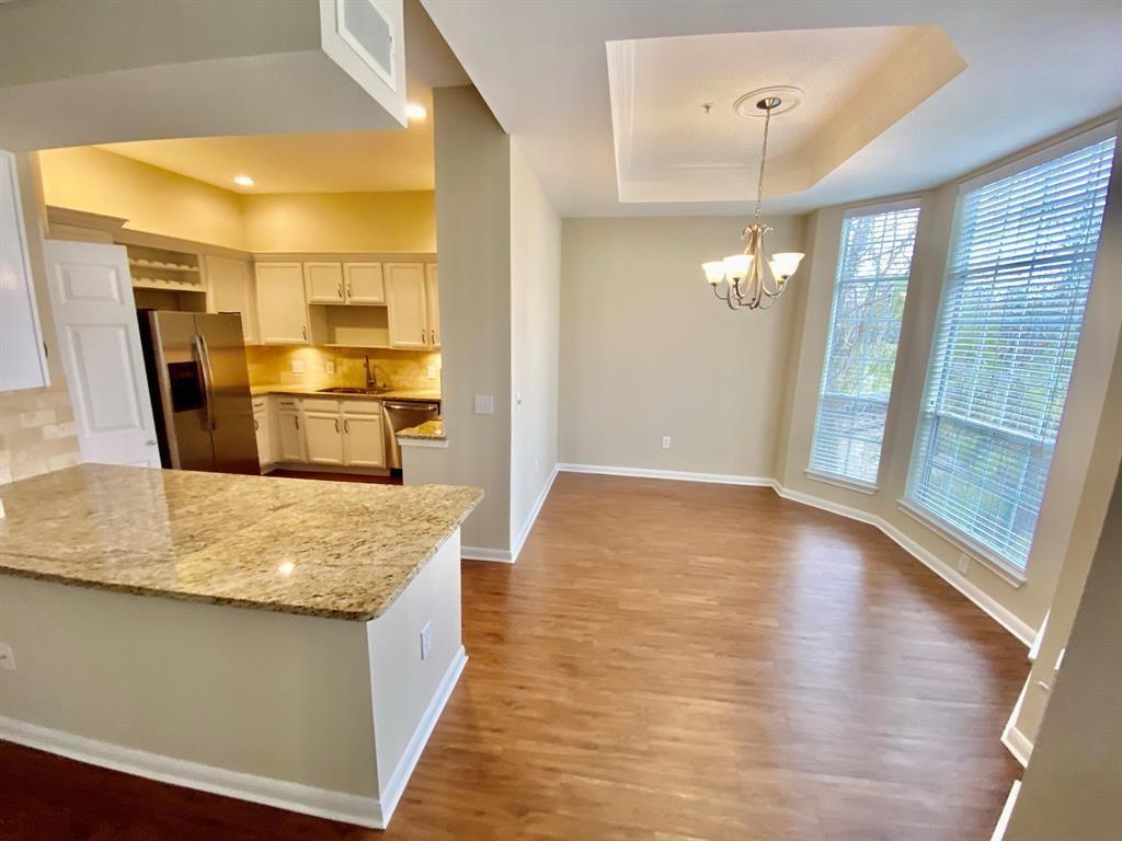 a view of kitchen with cabinets and wooden floor