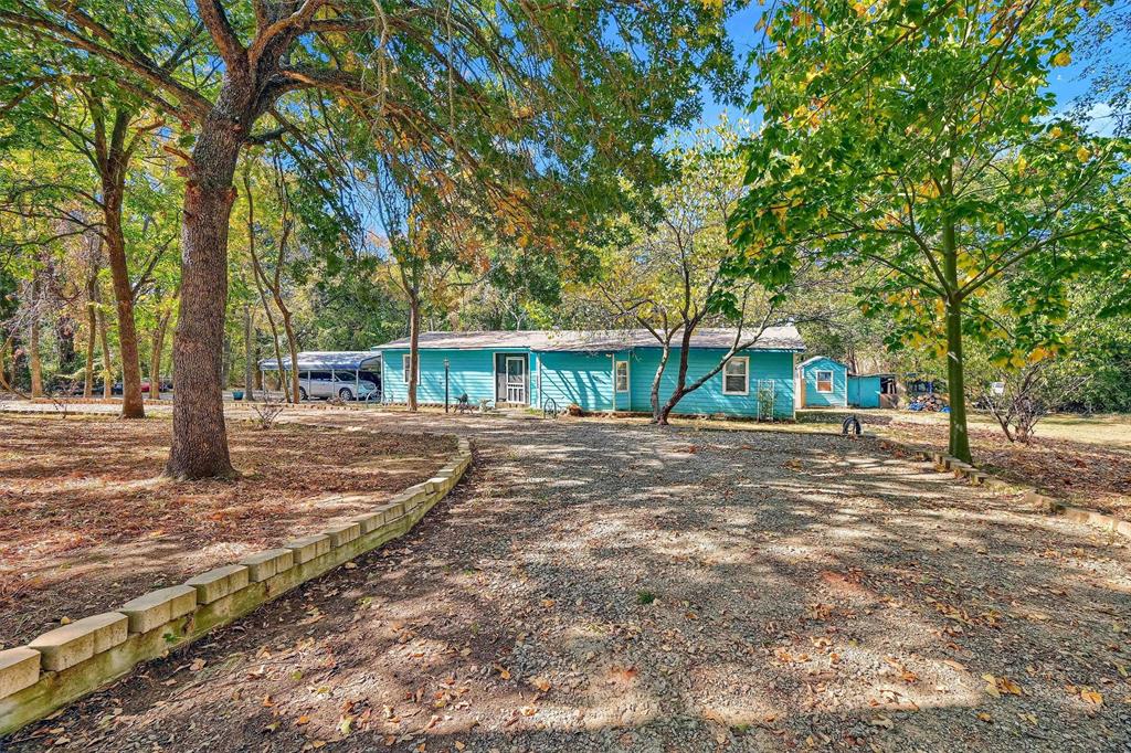 a view of house with trees in the background