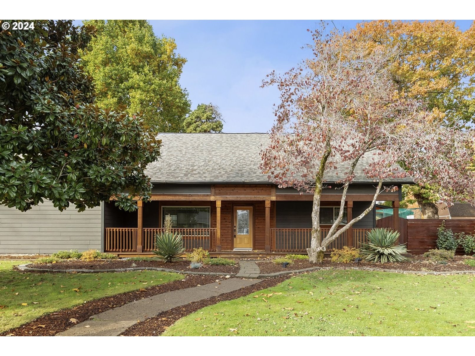 front view of a house with a yard