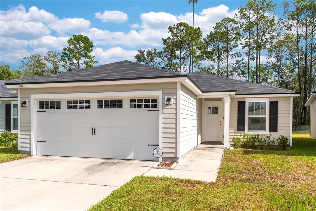 a front view of a house with a yard