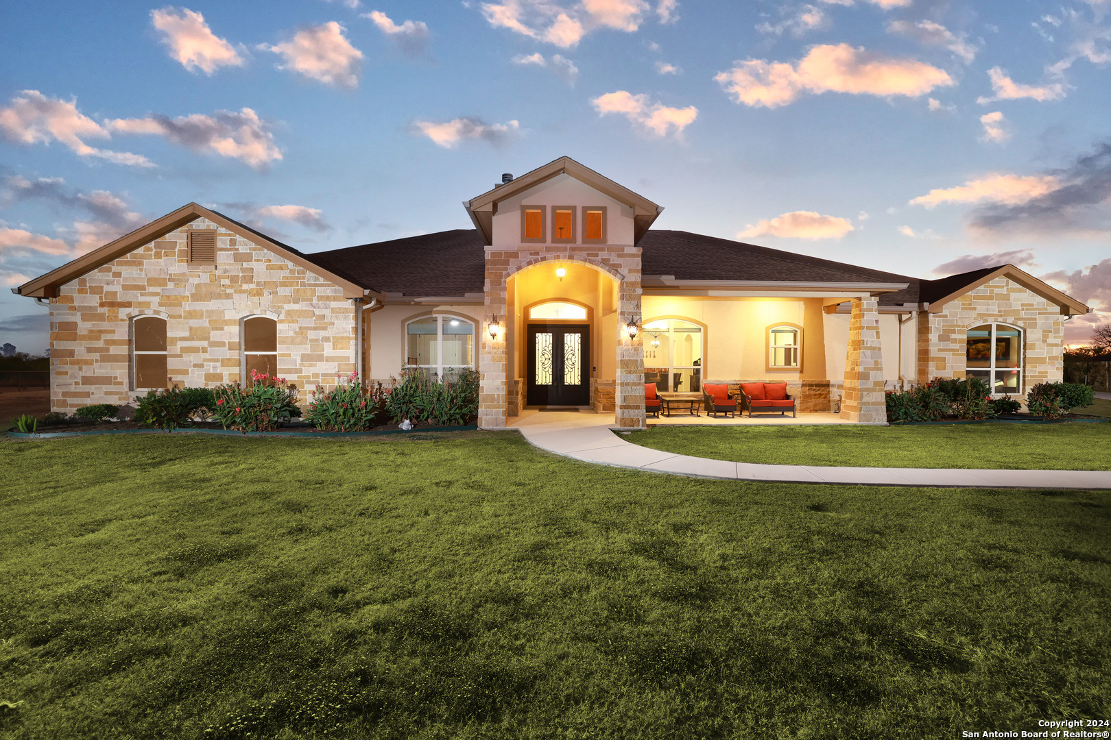 a front view of a house with a yard