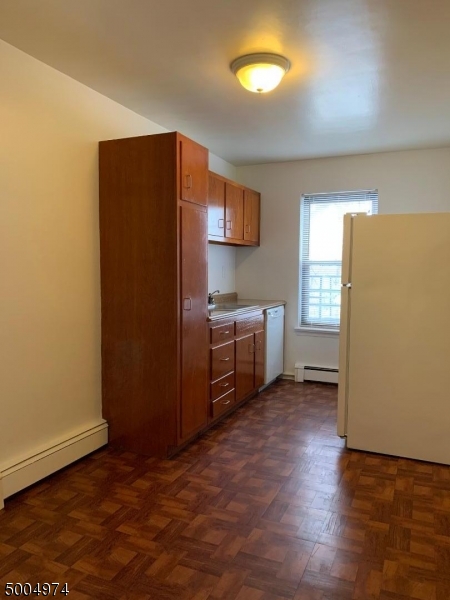 a kitchen with stainless steel appliances a refrigerator and a stove