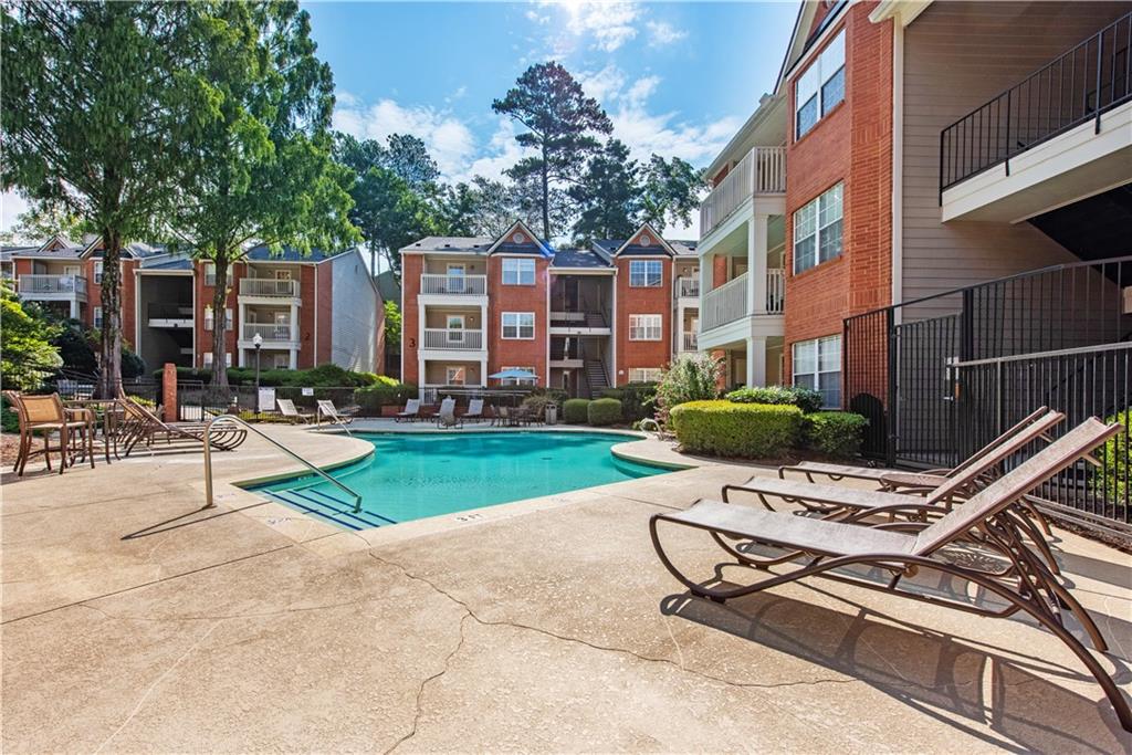 a view of a backyard with sitting area