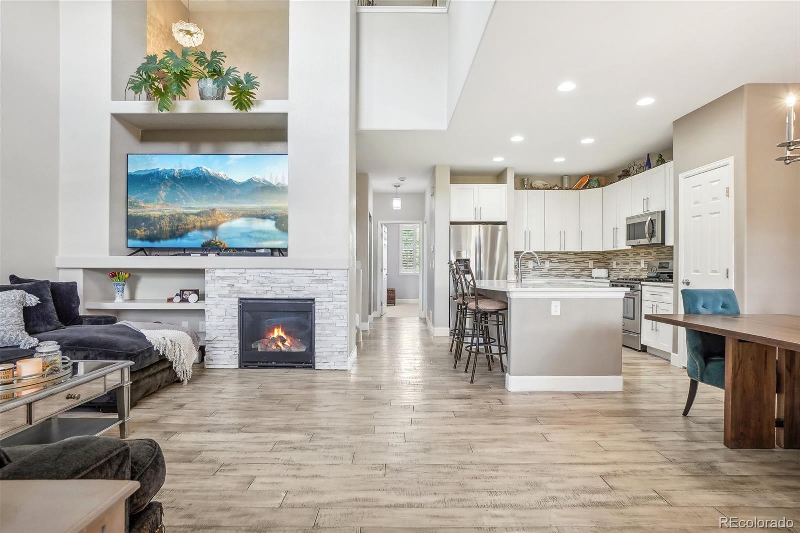 a view of kitchen with furniture and fireplace