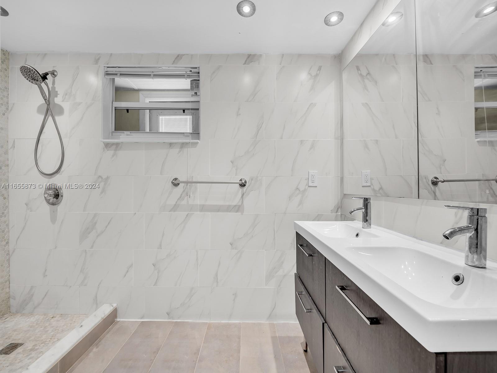 a bathroom with a sink a vanity and a mirror