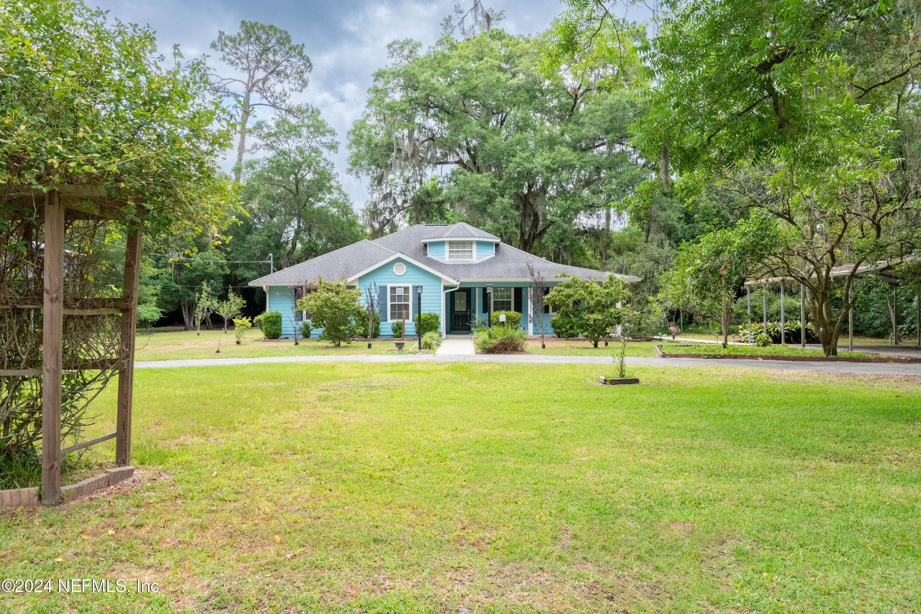 a front view of house with swimming pool yard and outdoor seating