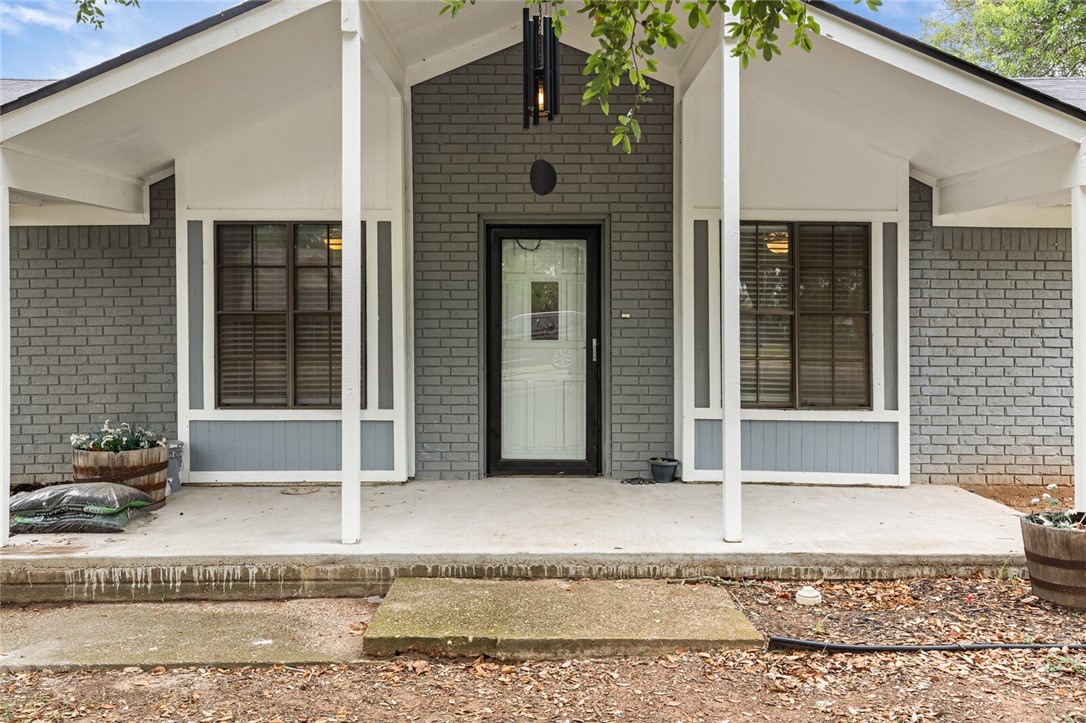 a front view of a house with a rug