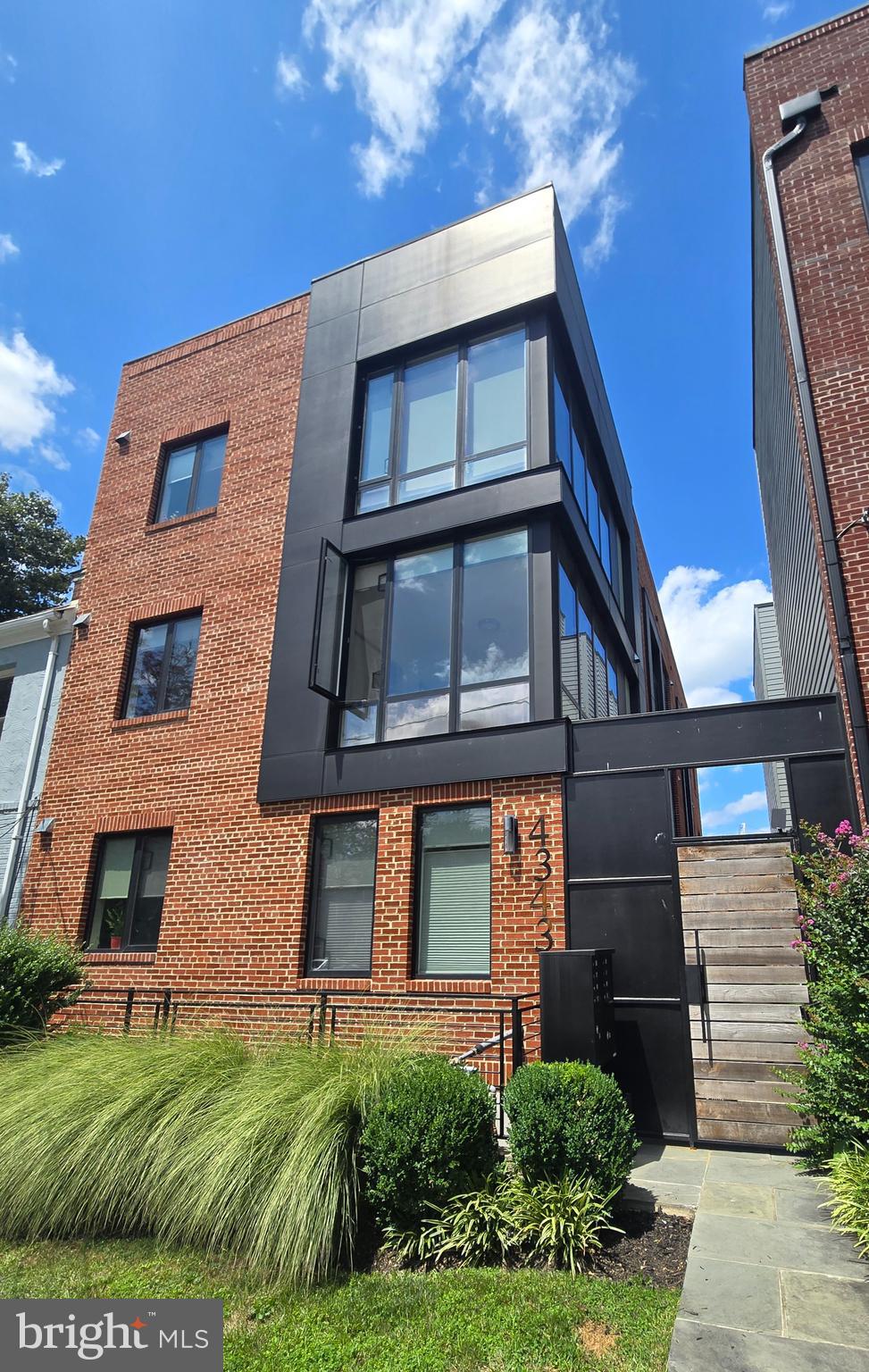 a brick building with a yard