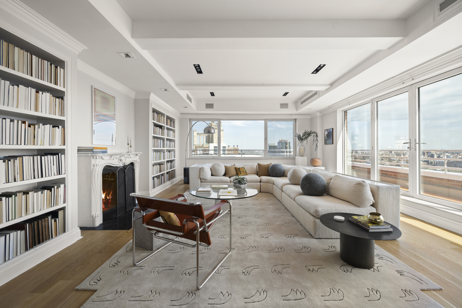 a living room with furniture and a book shelf