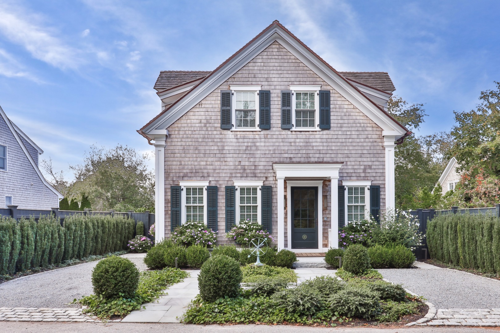 a front view of a house with garden