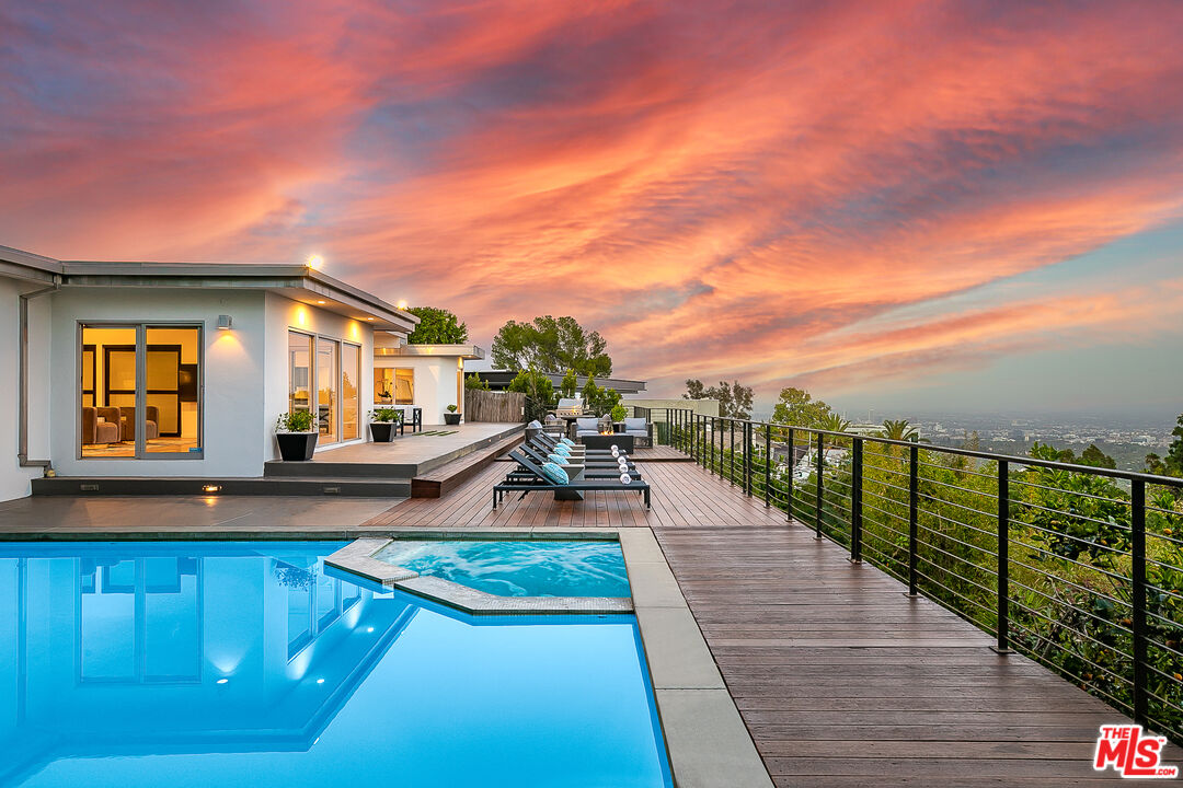 a view of a swimming pool with lounge chair