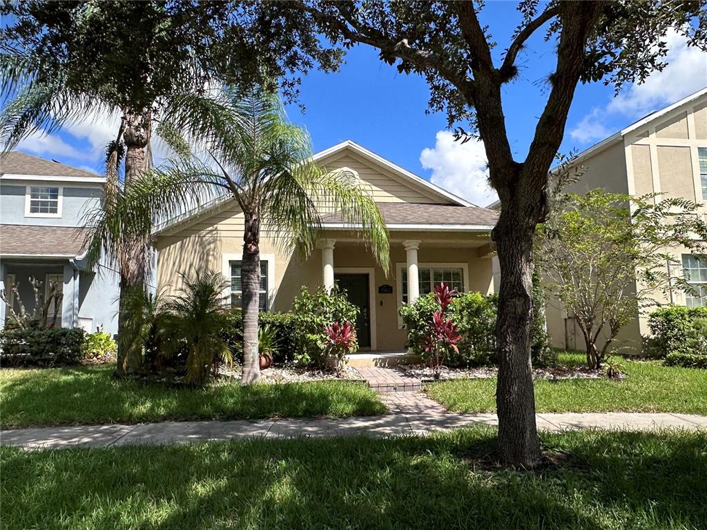 a front view of a house with garden