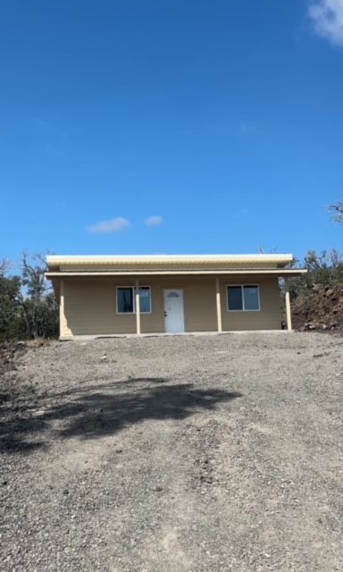 a front view of a house with yard