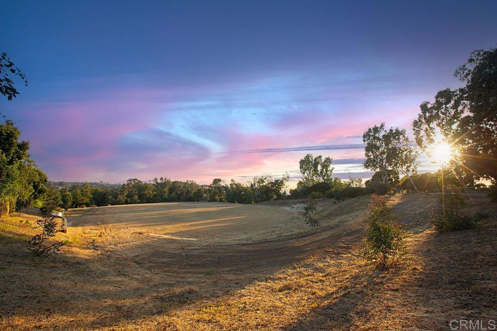 a view of lake with sunset