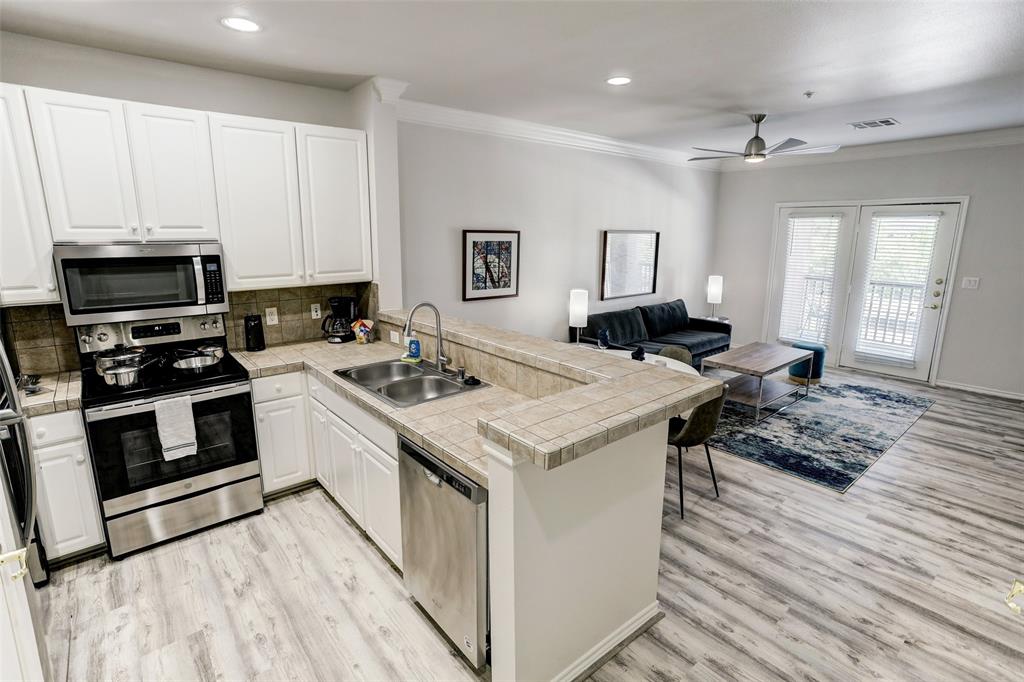 a kitchen with a stove and a sink