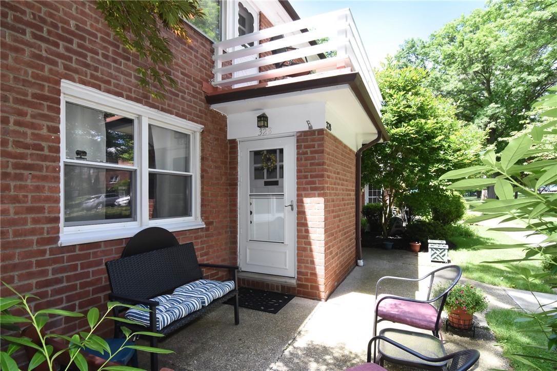 The sunny, oversized patio leads to the one-step entry.