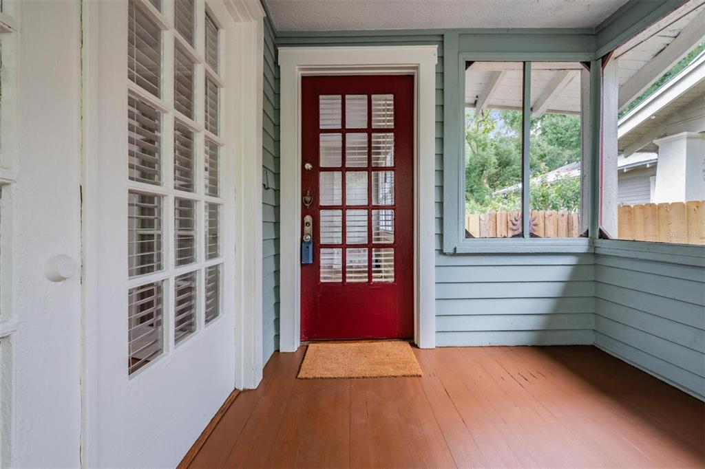 a view of front door and bedroom