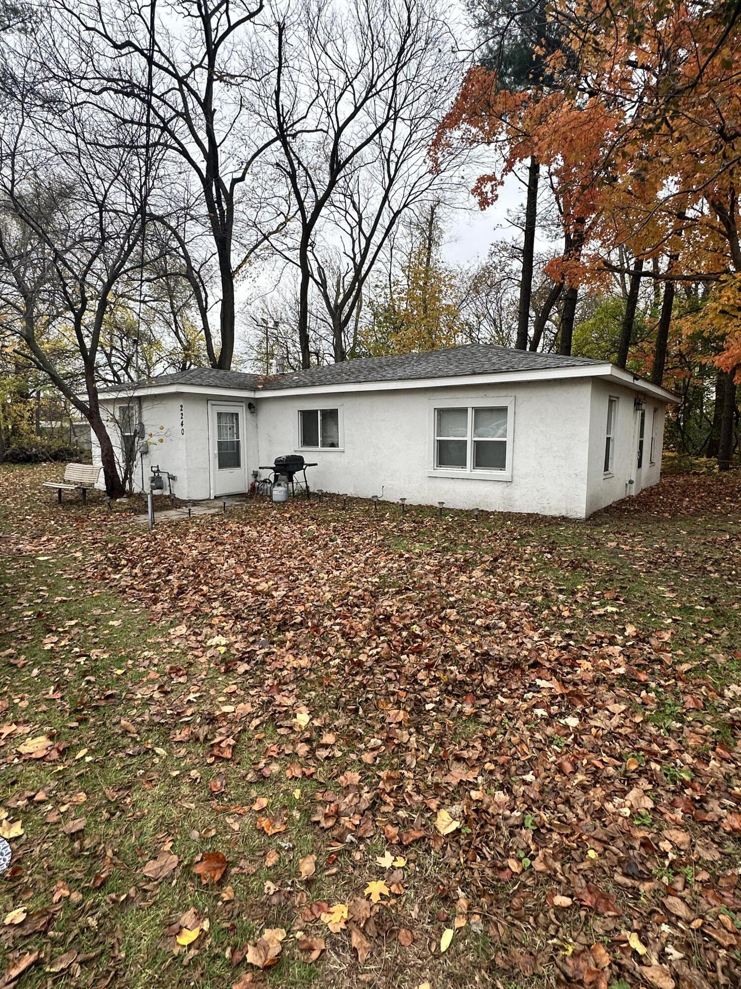 front view of house with a trees