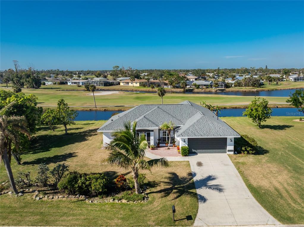 an aerial view of a house with a ocean view