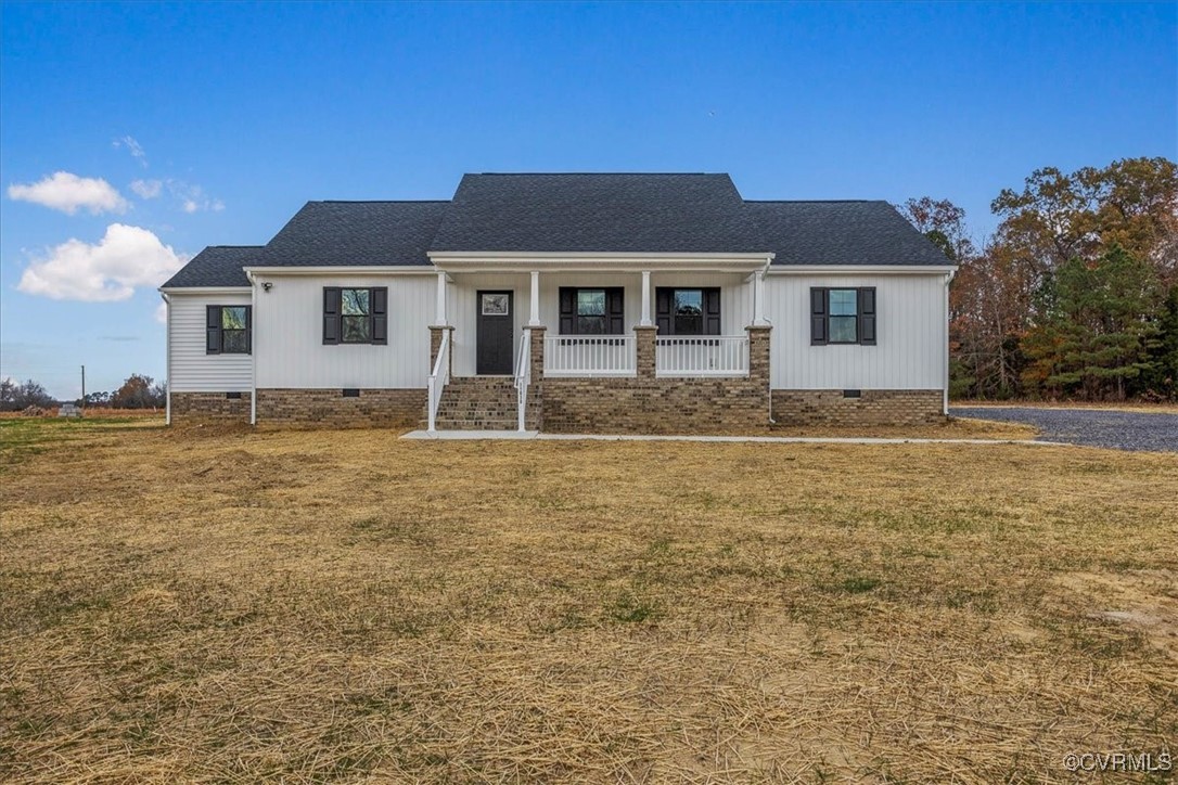 View of front of home featuring covered porch and