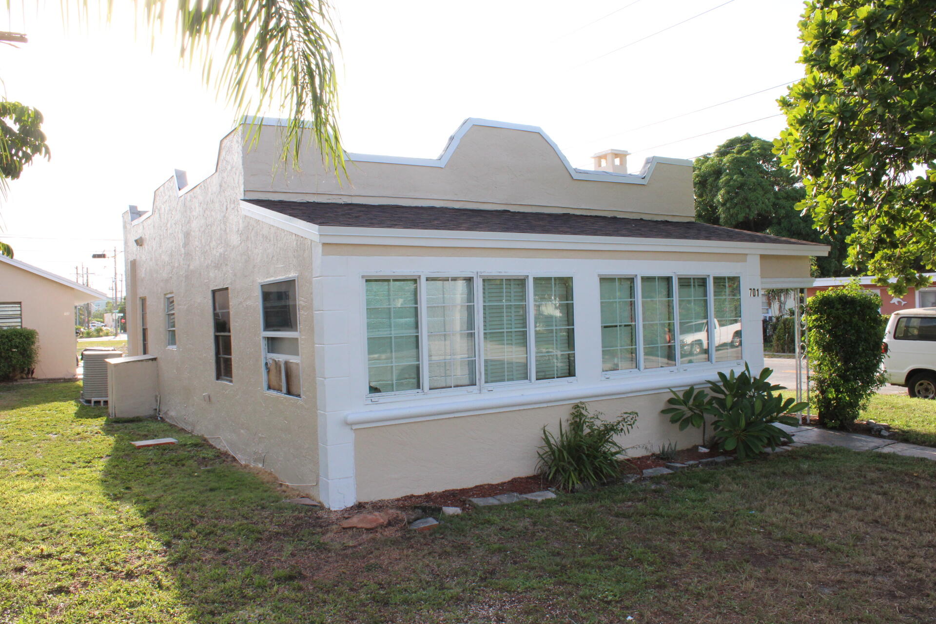 a view of house with a yard