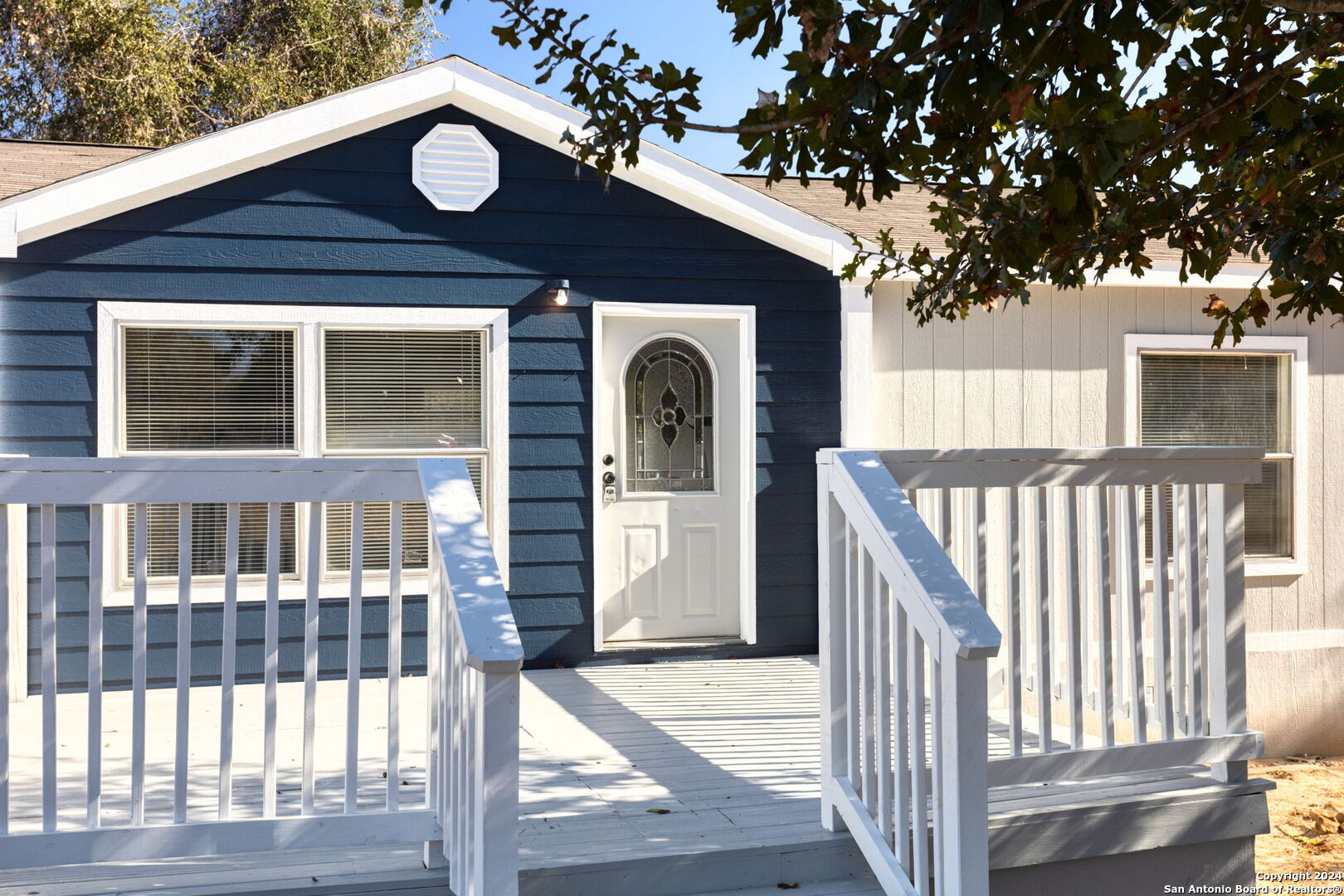 a front view of a house with a porch