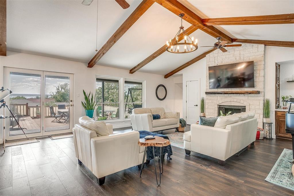 a living room with fireplace furniture and a flat screen tv