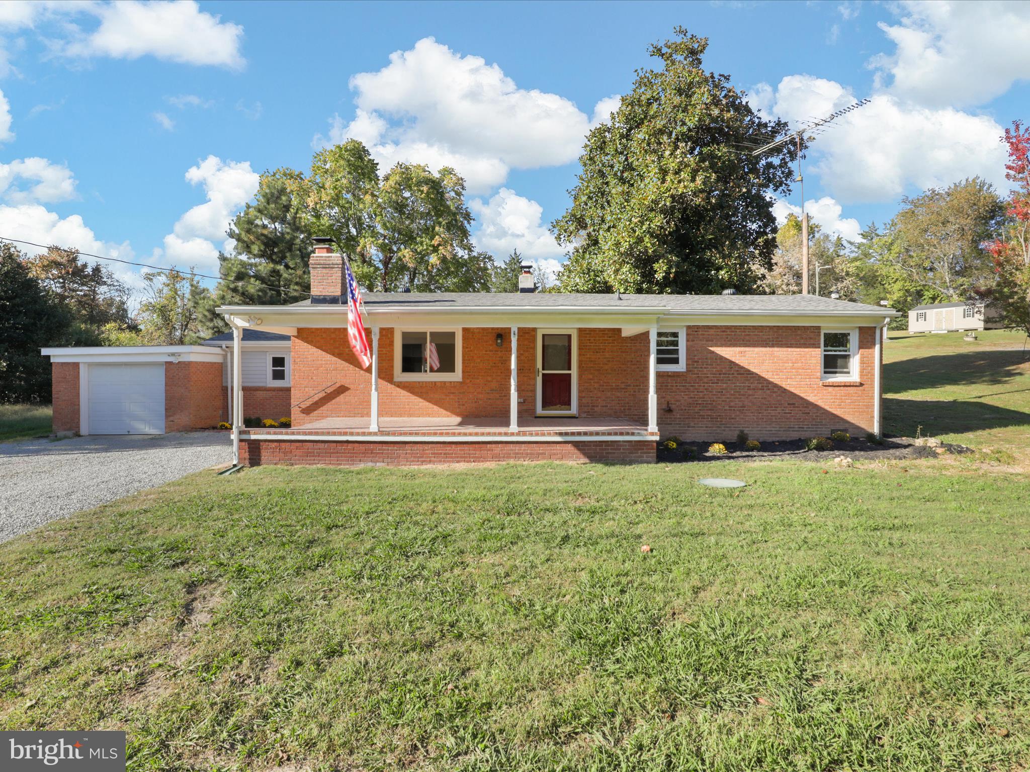 a view of an house with backyard space and garden