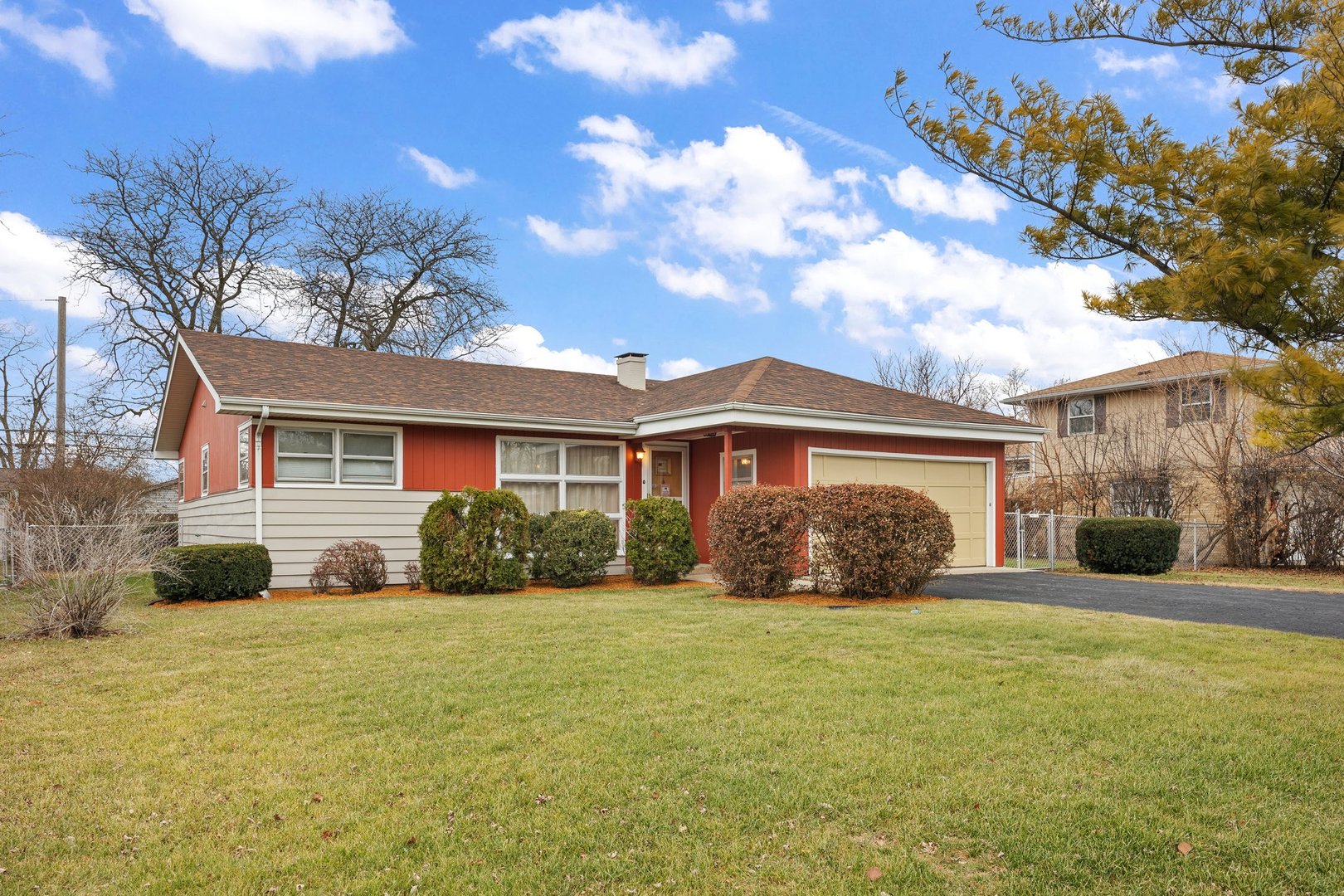 a front view of a house with yard