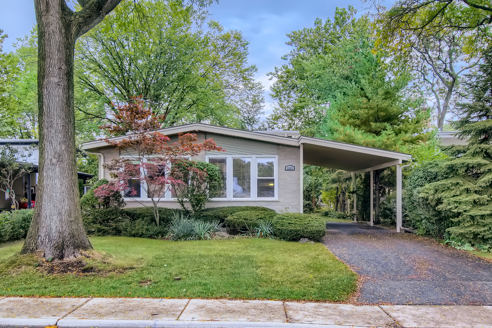 a view of front of house with a yard