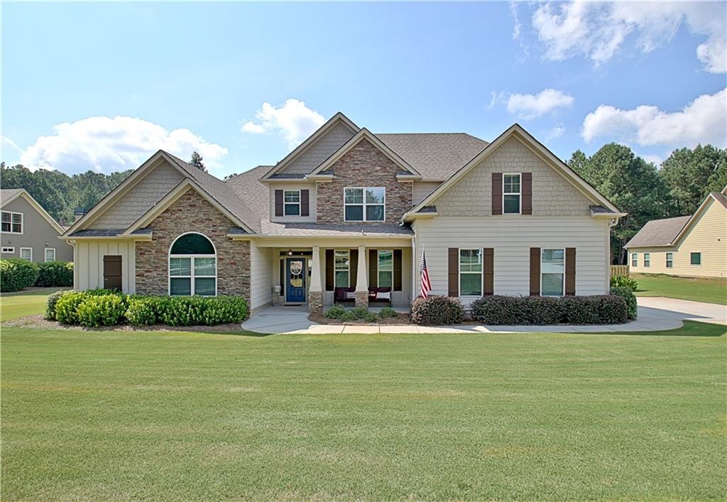 a front view of a house with a yard