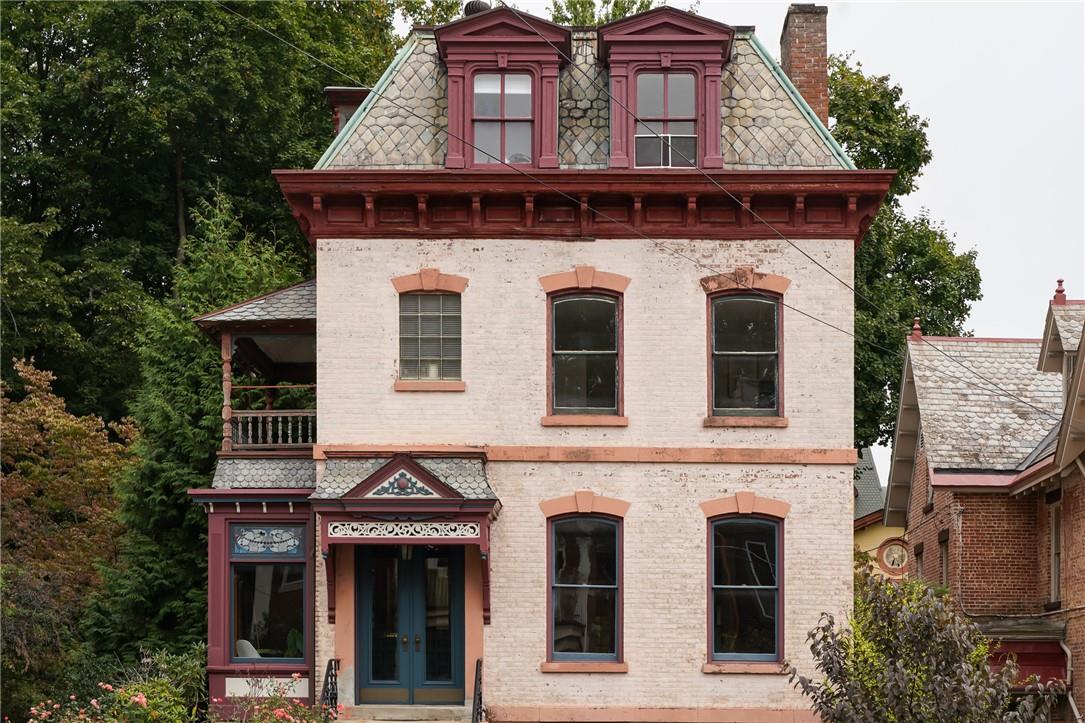 View of front of house featuring a balcony