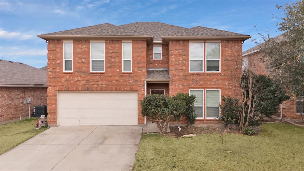 View of front of home with brick siding