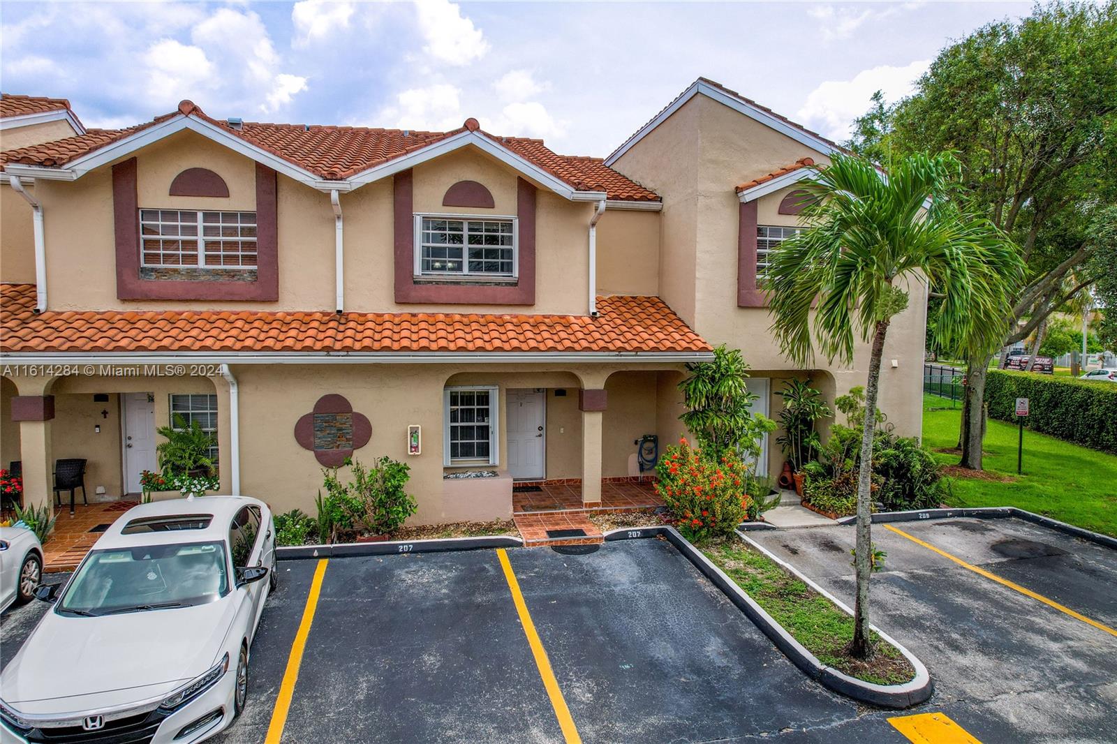 front view of a house with a yard