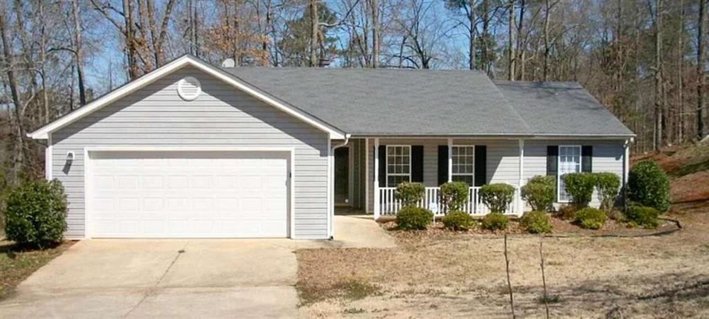 a view of house with yard