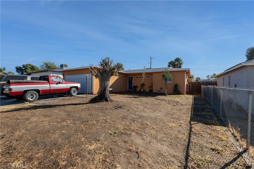 a front view of a house with parking space